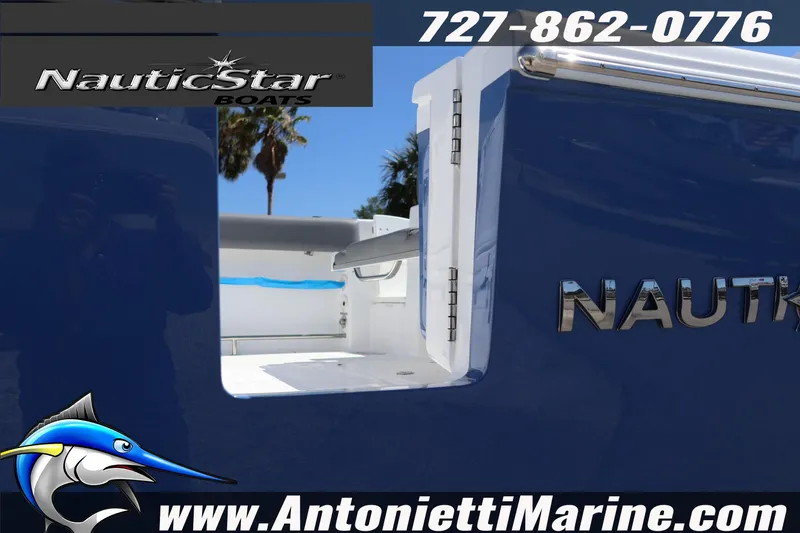Slide: The Image of 2026 NauticStar 292 Legacy boat, blue exterior, showcased by Antonietti Marine. - 38