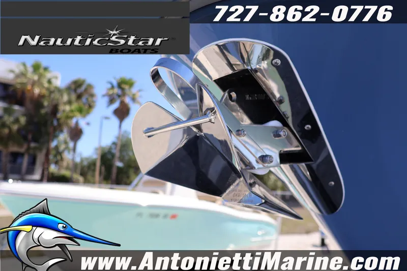 Slide: The Image of NauticStar 292 Legacy boat detail with propeller, showcasing sleek design and branding. - 6