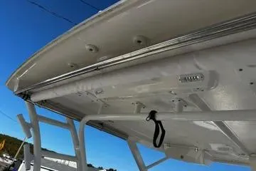 Slide: The Image of 2022 Robalo R317 Dual Console boat canopy, showcasing sturdy construction and sleek design. - 10