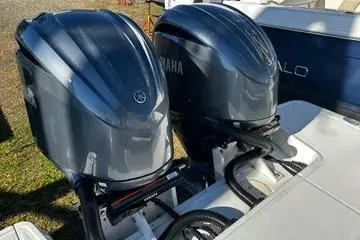 Slide: The Image of 2022 Robalo R317 Dual Console with twin Yamaha outboard engines. - 11