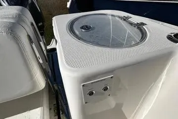 Slide: The Image of 2022 Robalo R317 Dual Console boat with a livewell feature. - 16