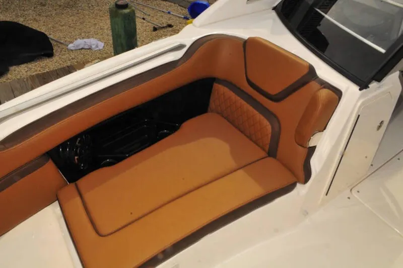 Slide: The Image of Luxurious seating on 2024 Yamaha Boats 275SDX, featuring tan upholstery and elegant design. - 12