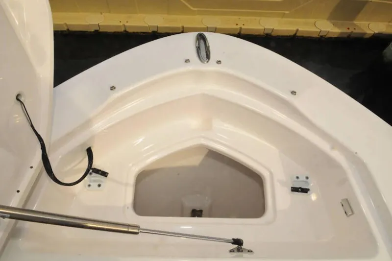Slide: The Image of Open storage compartment on 2024 Yamaha Boats 275SDX, showcasing interior design and functionality. - 14