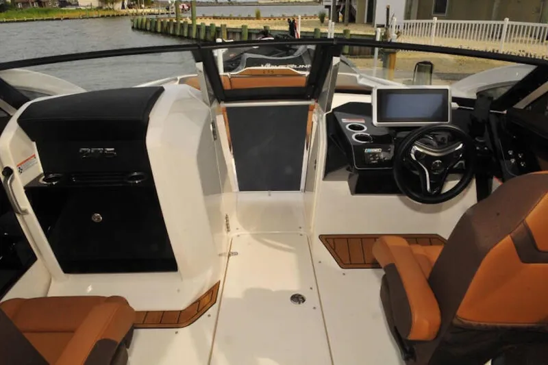 Slide: The Image of 2024 Yamaha Boats 275SDX cockpit with modern dashboard and luxurious seating. - 15