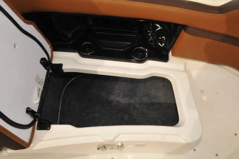 Slide: The Image of Interior view of 2024 Yamaha Boats 275SDX, featuring seating and storage area. - 20