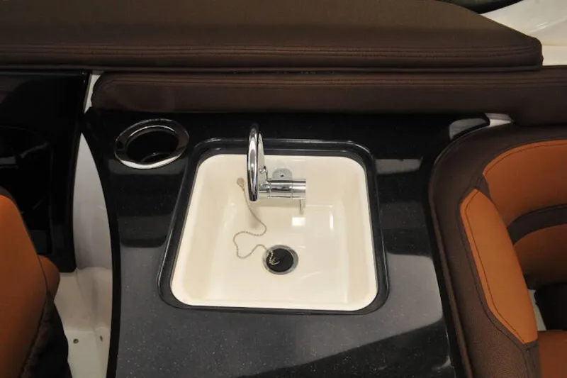 Slide: The Image of 2024 Yamaha Boats 275SDX interior sink with sleek design and modern faucet. - 25