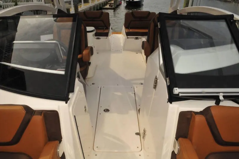 Slide: The Image of 2024 Yamaha Boats 275SDX interior with brown seating and sleek design. - 26