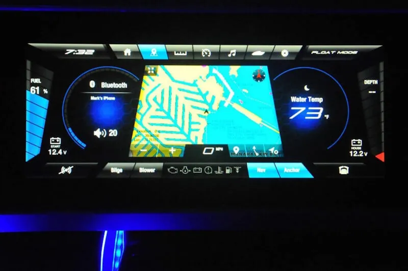 Slide: The Image of Dashboard display of 2024 Yamaha Boats 275SDX showing navigation, Bluetooth, and water temperature. - 32