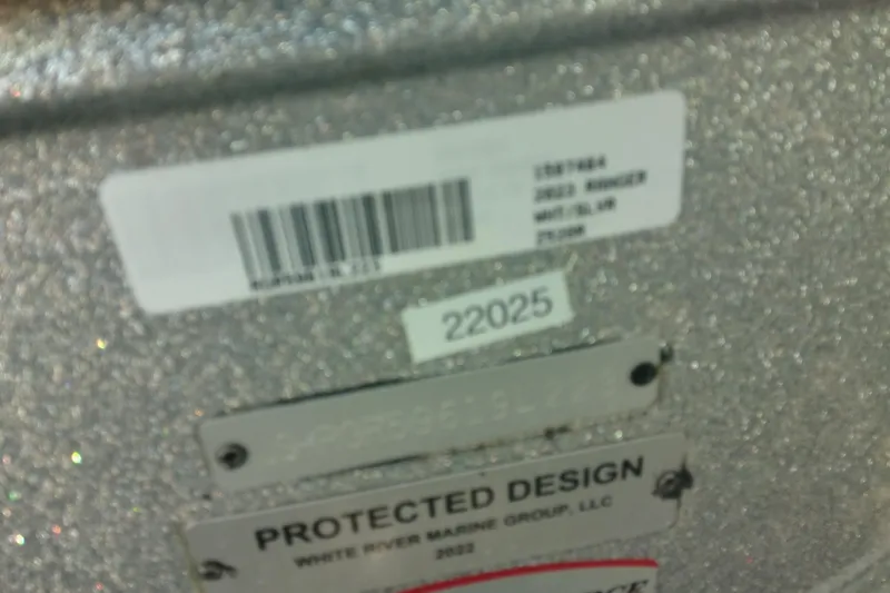 Slide: The Image of Barcode and labels on 2023 Ranger Z520R boat, featuring serial and design information. - 10