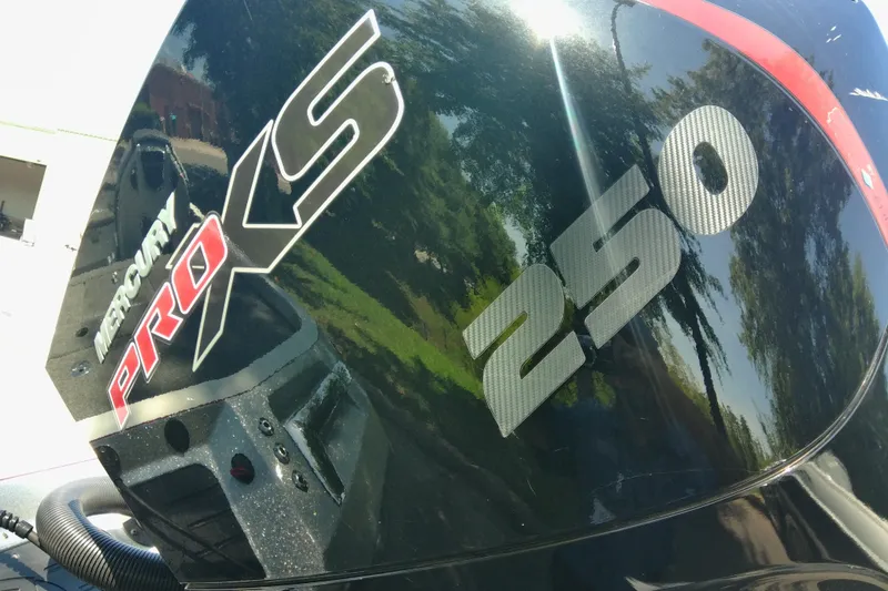 Slide: The Image of Mercury Pro XS 250 engine on 2023 Ranger Z520R boat, reflecting outdoor scenery. - 5