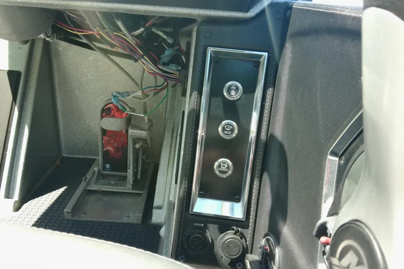 Slide: The Image of Interior controls of a 2023 Ranger Z520R boat, featuring wiring and pedal setup. - 6