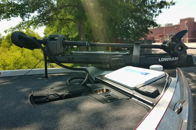 Slide: The Image of 2023 Ranger Z520R boat with Lowrance Ghost trolling motor and electronics, parked outdoors. - 9