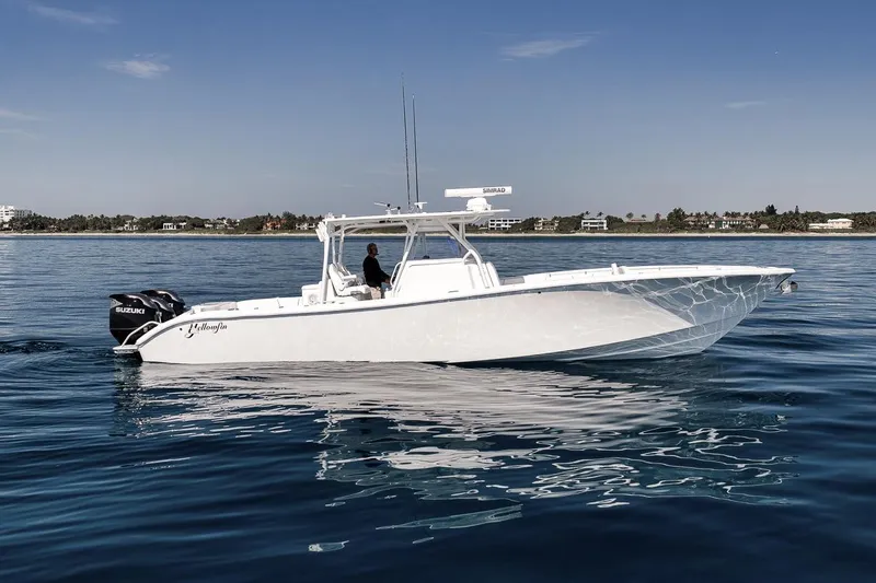 The Image of 2012 Yellowfin 39 Offshore boat on calm blue water, side view. - 0