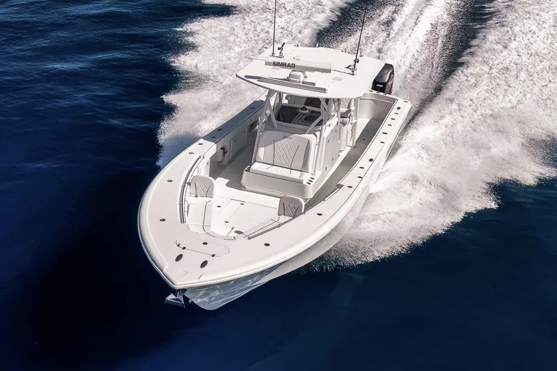 Slide: The Image of 2012 Yellowfin 39 Offshore boat cruising on open water. - 11