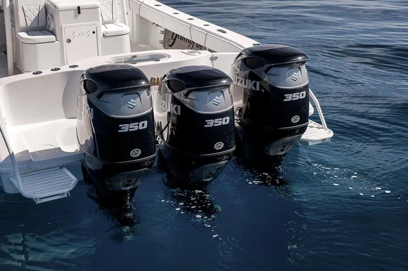 Slide: The Image of 2012 Yellowfin 39 Offshore boat with triple Suzuki 350 outboard engines on water. - 28