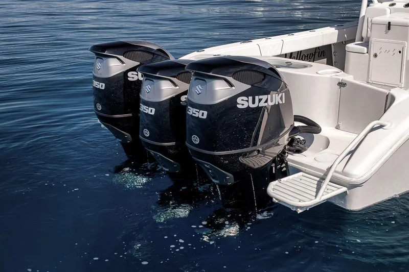 Slide: The Image of 2012 Yellowfin 39 Offshore boat with triple Suzuki 350 outboard engines on calm water. - 29