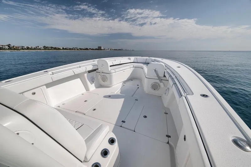 Slide: The Image of 2012 Yellowfin 39 Offshore boat with spacious deck, cruising on calm ocean waters. - 31