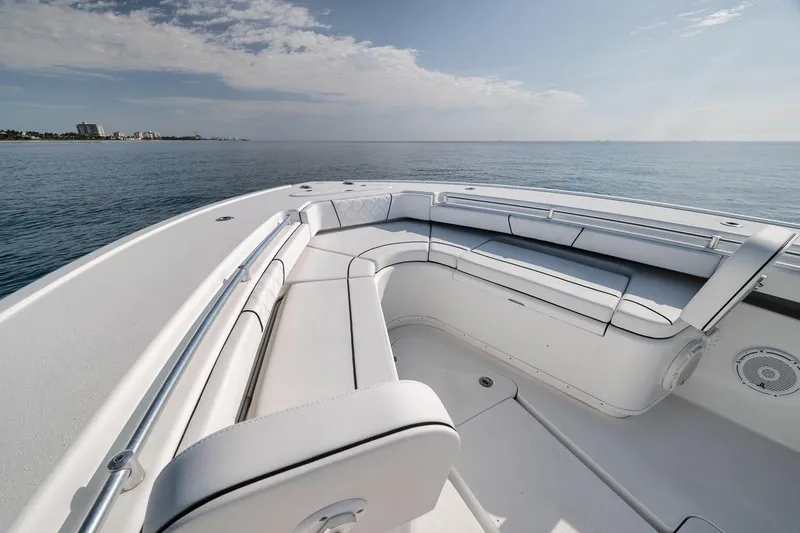 Slide: The Image of 2012 Yellowfin 39 Offshore boat with spacious seating, overlooking calm ocean waters. - 32