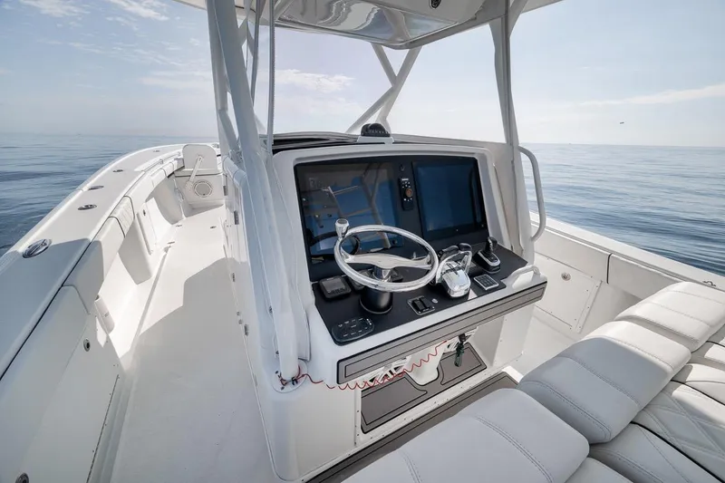 Slide: The Image of 2012 Yellowfin 39 Offshore boat interior with modern helm and ocean view. - 35