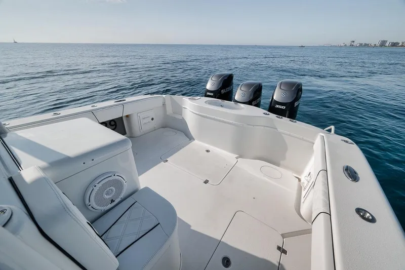 Slide: The Image of 2012 Yellowfin 39 Offshore boat with triple Suzuki engines on open sea. - 38