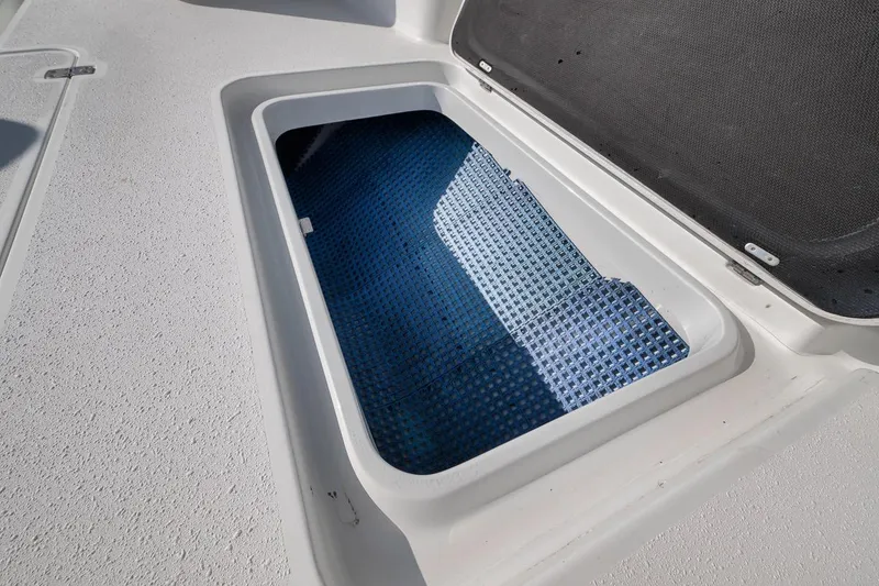 Slide: The Image of Open storage compartment on 2012 Yellowfin 39 Offshore boat deck. - 47