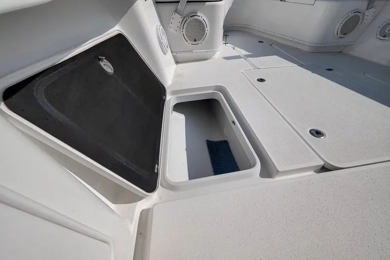 Slide: The Image of Open storage compartment on 2012 Yellowfin 39 Offshore boat deck. - 48