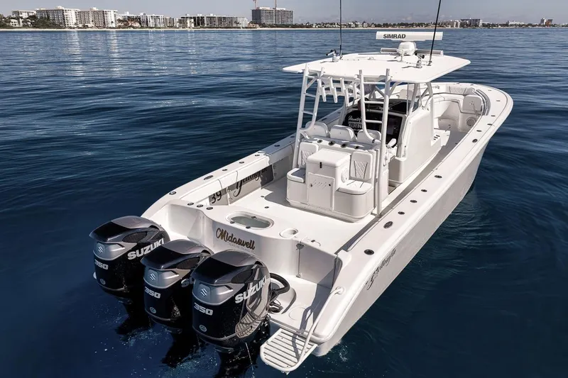 Slide: The Image of 2012 Yellowfin 39 Offshore boat with triple Suzuki engines on calm water. - 5