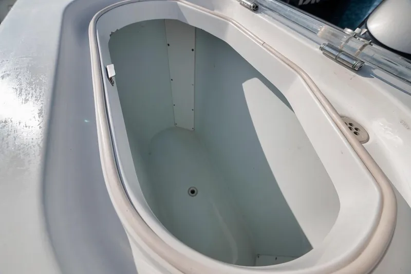 Slide: The Image of Livewell on 2012 Yellowfin 39 Offshore boat, featuring a clean, white interior. - 50