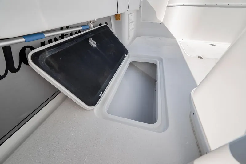 Slide: The Image of 2012 Yellowfin 39 Offshore boat storage compartment with open hatch. - 51