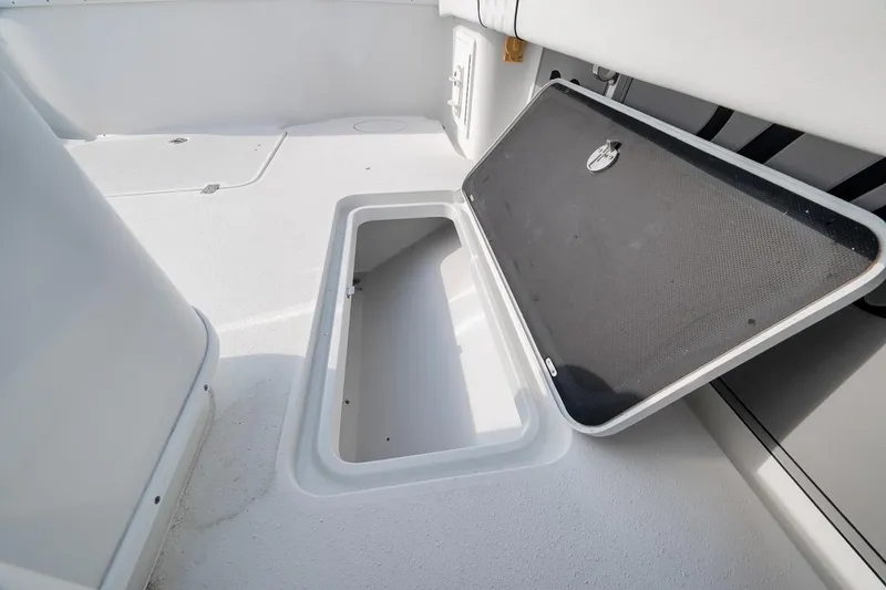 Slide: The Image of Open storage compartment on 2012 Yellowfin 39 Offshore boat deck. - 52