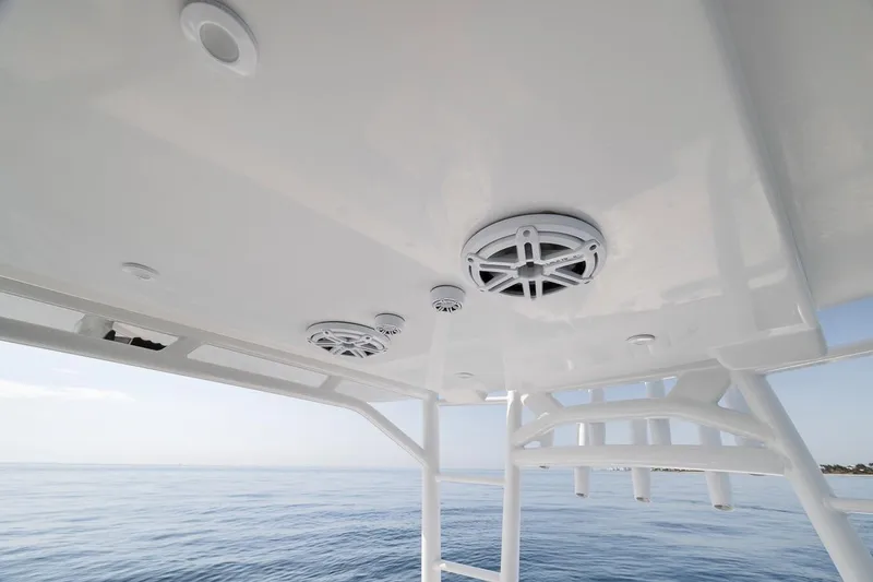 Slide: The Image of 2012 Yellowfin 39 Offshore boat speakers and structure over calm ocean waters. - 53