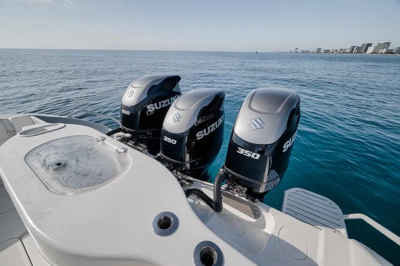 Slide: The Image of 2012 Yellowfin 39 Offshore boat with three Suzuki 350 engines on open water. - 55