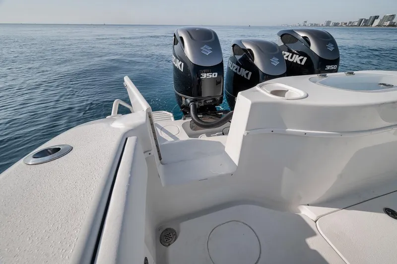 Slide: The Image of 2012 Yellowfin 39 Offshore boat with Suzuki 350 engines on calm ocean waters. - 56