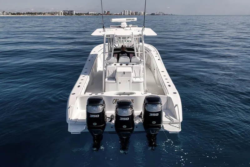 Slide: The Image of 2012 Yellowfin 39 Offshore boat with triple 350 engines on open water. - 8