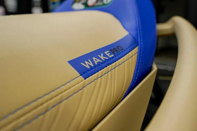 Slide: The Image of 2026 Sea-Doo Wake Pro 230 seat detail with blue and beige design. - 13