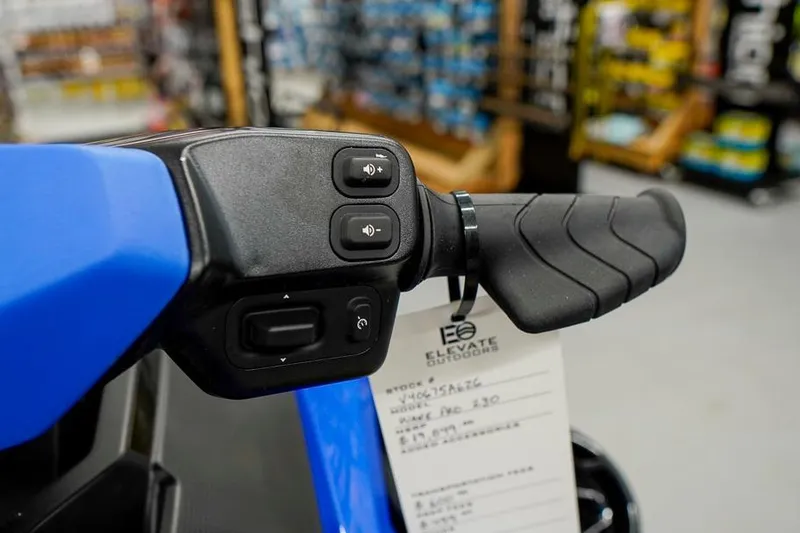 Slide: The Image of Handlebar controls of 2026 Sea-Doo Wake Pro 230 in a showroom setting. - 18