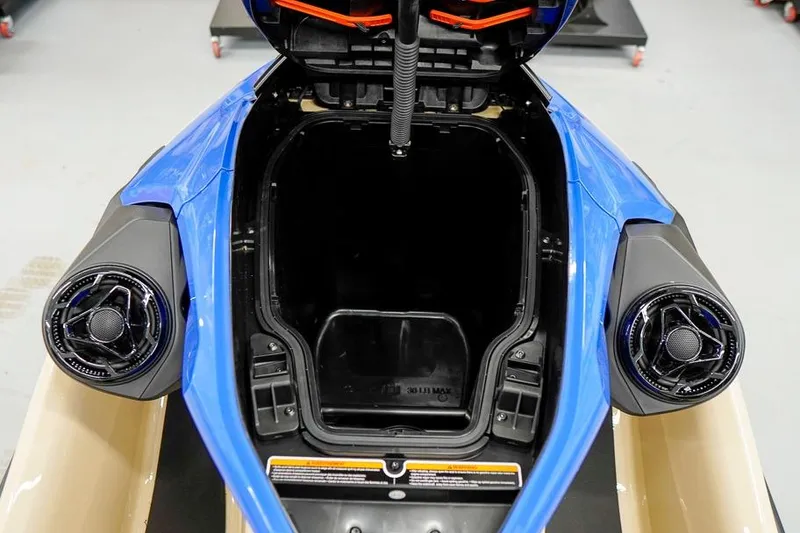 Slide: The Image of 2026 Sea-Doo Wake Pro 230 storage compartment with open lid, showcasing interior space. - 20