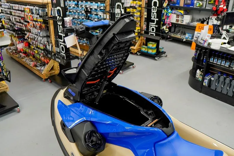 Slide: The Image of 2026 Sea-Doo Wake Pro 230 with open storage compartment in a marine supply store. - 22