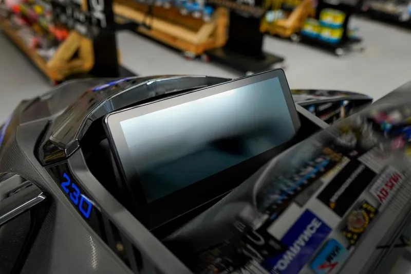 Slide: The Image of 2026 Sea-Doo Wake Pro 230 dashboard with digital display in a showroom. - 23