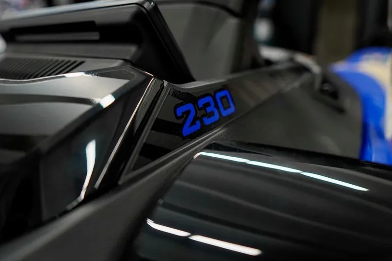 Slide: The Image of Close-up of 2026 Sea-Doo Wake Pro 230, showcasing sleek design and bold "230" emblem. - 24