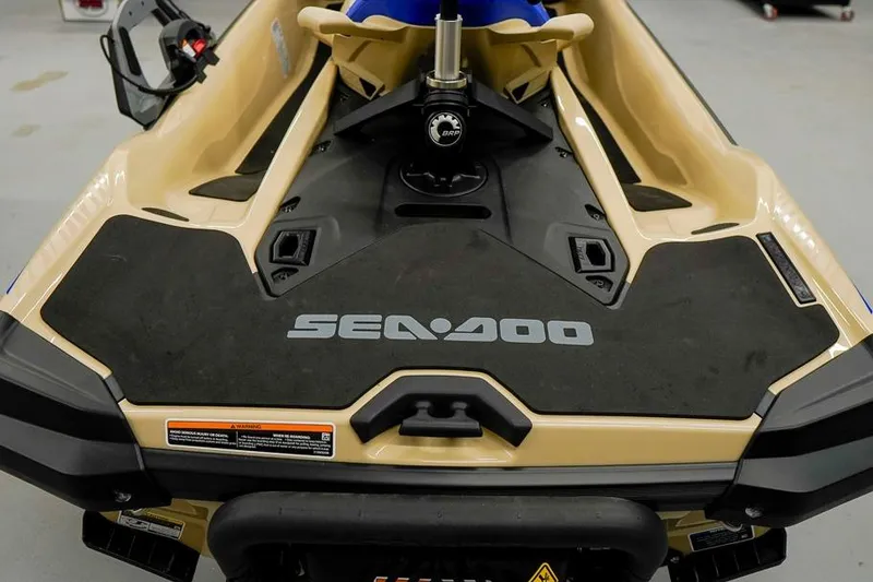 Slide: The Image of 2026 Sea-Doo Wake Pro 230 jet ski, beige and black design, rear view. - 3