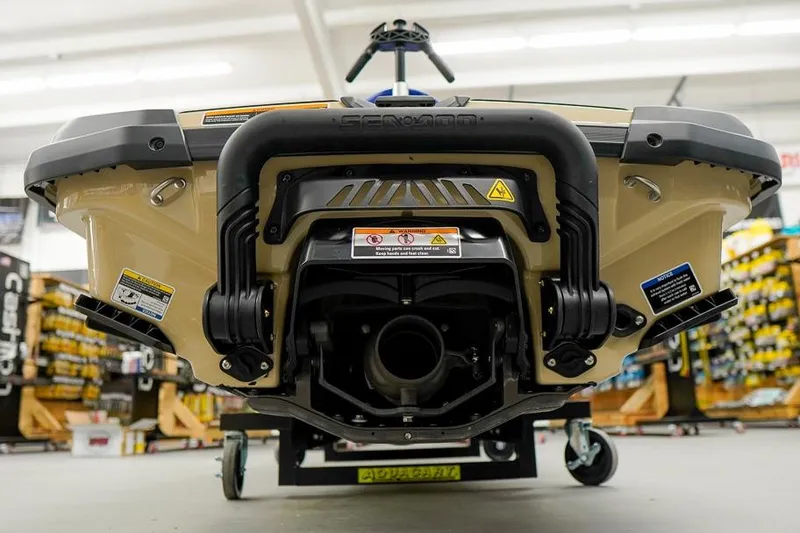 Slide: The Image of 2026 Sea-Doo Wake Pro 230 jet ski rear view in showroom setting. - 7