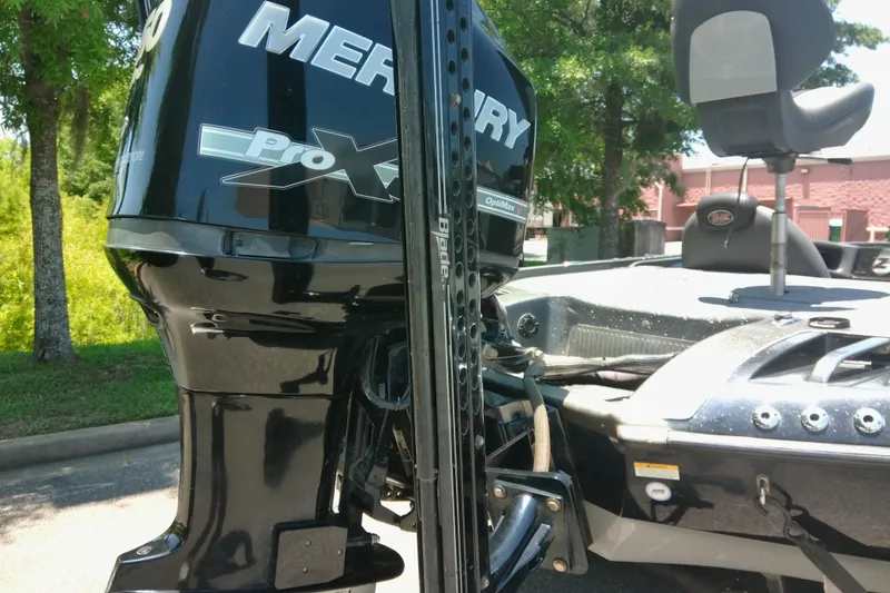 Slide: The Image of 2012 Ranger Z520 boat with Mercury Pro XS engine, parked outdoors. - 6