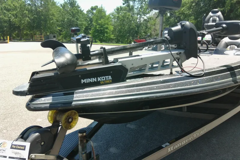 Slide: The Image of 2012 Ranger Z520 boat with Minn Kota Ultrex trolling motor in a sunny outdoor setting. - 9