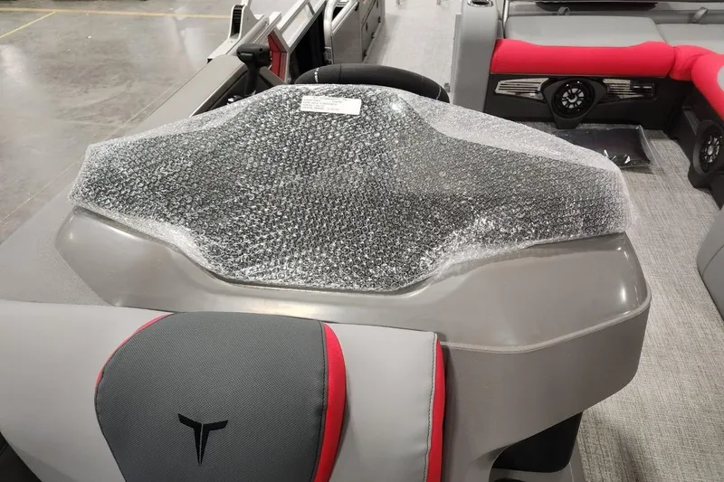 Slide: The Image of 2026 Tahoe Pontoon LTZ 2585 VRB dashboard with bubble wrap protection. - 3