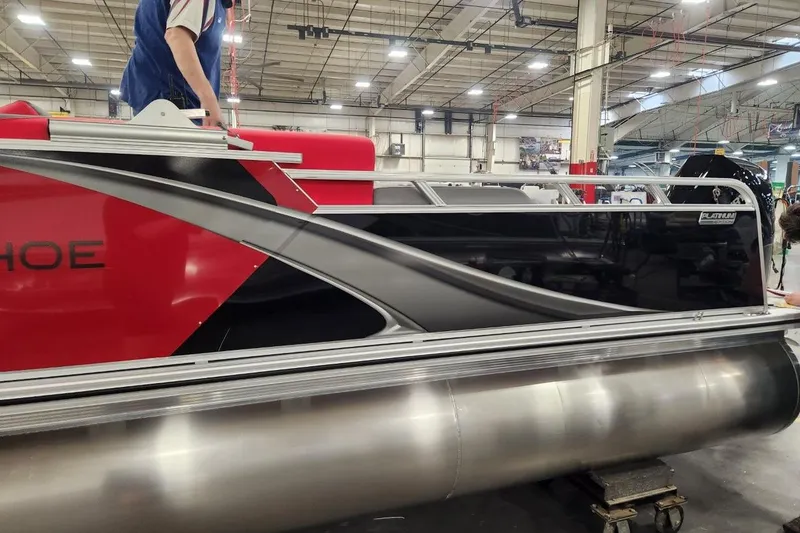 Slide: The Image of 2026 Tahoe Pontoon LTZ 2585 VRB in a factory setting, showcasing sleek design. - 4