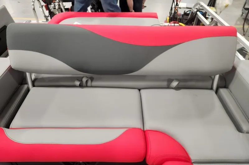 Slide: The Image of 2026 Tahoe Pontoon LTZ 2585 VRB seating with red and gray upholstery. - 6