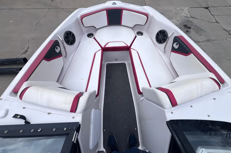 Slide: The Image of Interior of a 2014 Scarab 195 H.O. boat with red and white seating. - 10