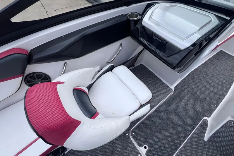 Slide: The Image of Interior of a 2014 Scarab 195 H.O. boat with red and white seating. - 12