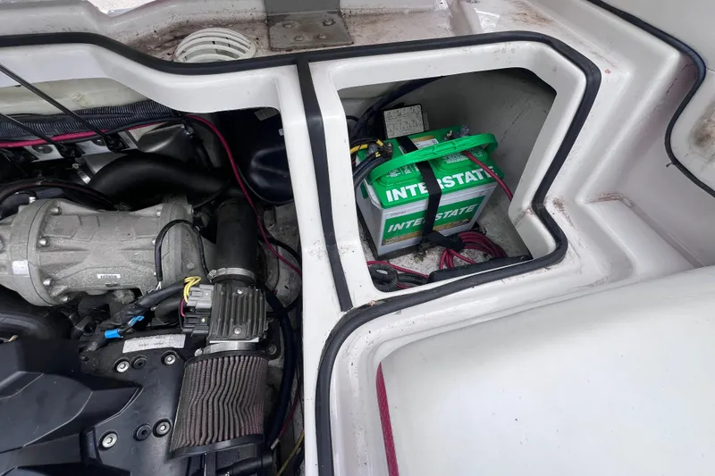 Slide: The Image of Engine compartment of a 2014 Scarab 195 H.O. with Interstate battery visible. - 14